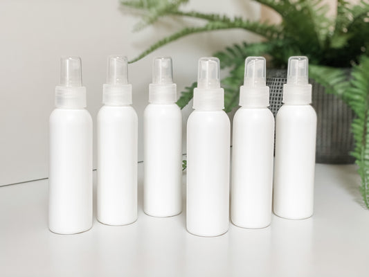 White Plastic HDPE 4 oz Bullet Round Bottles with White Fine Mist Sprayer - Homage Essentials & Co